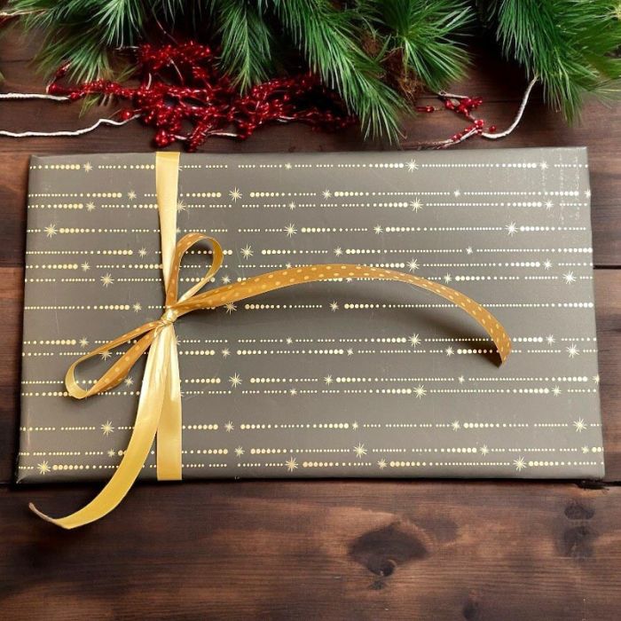 Jólapappír B 50 cm. Svartur við stjørnuskúmi. 100 mtr *