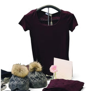 SuperSellerS chrome t-shirt display stand with a foam hanger holding a dark purple shirt, next to winter hats.