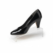 SuperSellerS clear acrylic shoe display stand holding a black high heel pump on a white background